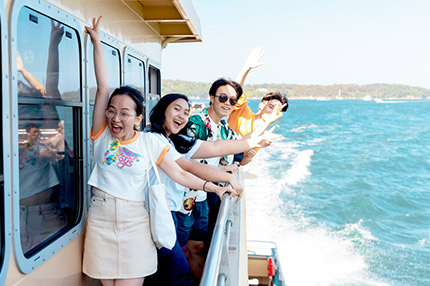 Students on ferry happy sydney harbour