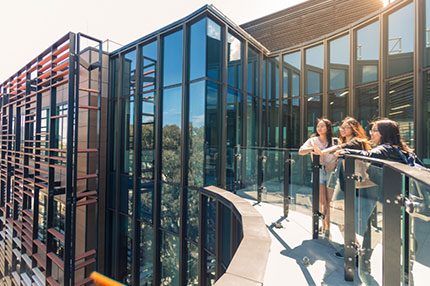 Students standing outside building